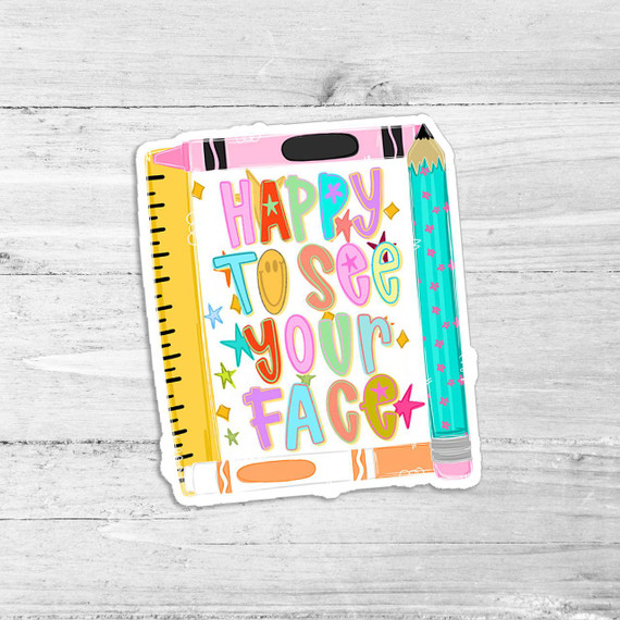 Happy to See Your Face Die Cut Vinyl Sticker, colorful illustrated design of a notebook with a pink pen and the phrase 'Happy to See Your Face' in vibrant colors.