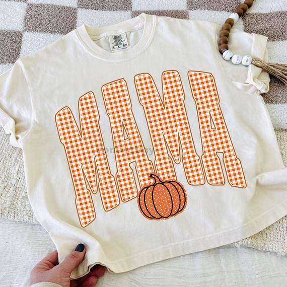 Gingham Mama DTF Heat Transfer, orange and white checkered pumpkin design on a white t-shirt.