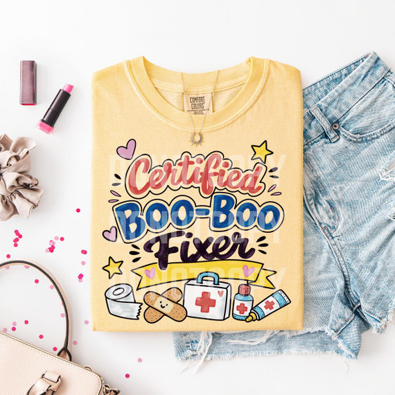 Certified Boo Boo Fixer DTF Heat Transfer, colorful illustrated graphic design on a yellow T-shirt with medical and healing-themed images.