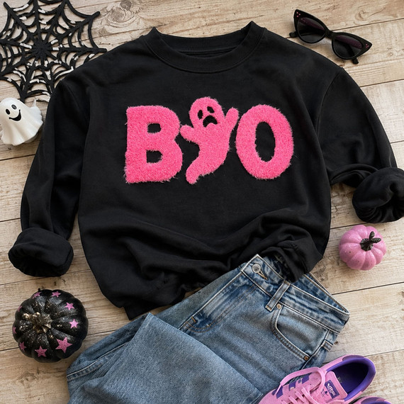 Neon pink fluffy chenille Boo iron-on patch featuring an adorable ghost replacing the second "O" for Halloween apparel and boutique clothing.