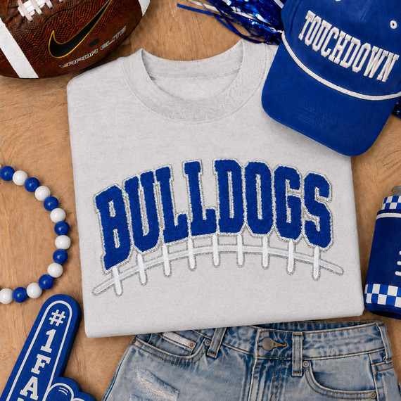Royal blue Bulldogs varsity chenille iron-on patch with football lace embroidery for game day apparel, school spirit wear, and boutique clothing.