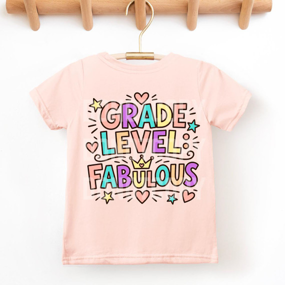Grade Level Fabulous DTF Heat Transfer, colorful and playful design on a pink children's T-shirt with hearts, stars, and a crown