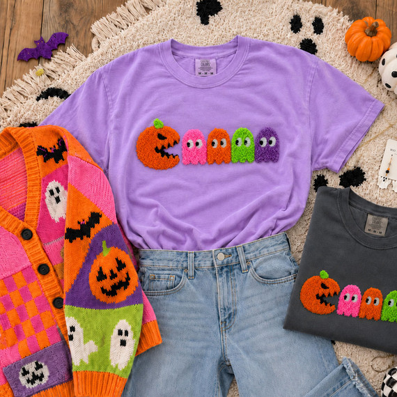 Soft fluffy Halloween appliqué patch featuring a smiling pumpkin and colorful ghost characters in orange, pink, green, and purple with a plush textured finish.