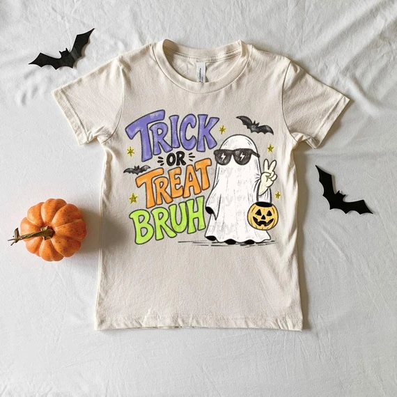 Trick Or Treat Bruh DTF Heat Transfer, graphic T-shirt with Halloween-themed ghost, bats, and pumpkin design.