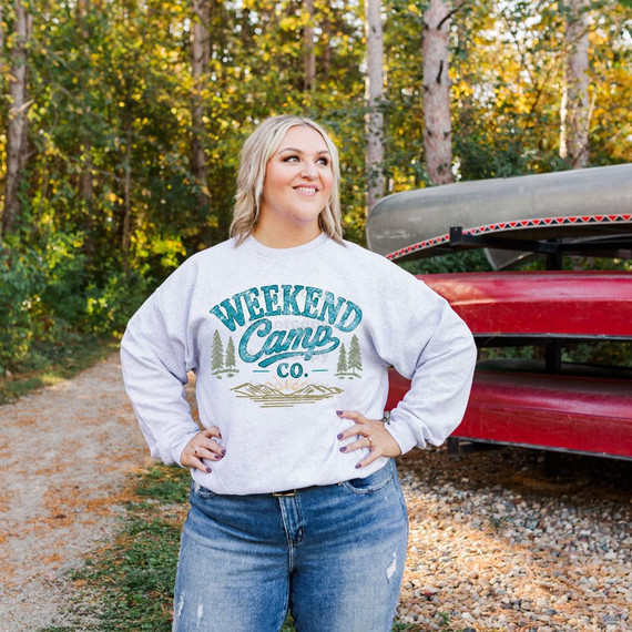 Weekend Camp Co DTF Heat Transfer, design printed on a woman's sweatshirt for outdoor camping attire.