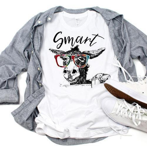 Smart Donkey Sublimation Transfer, a white t-shirt with a graphic of a donkey wearing glasses and the word 'Smart', paired with casual sneakers and a gray shirt, showcasing customized apparel printing.