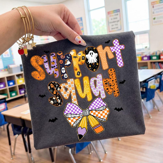 Support Squad Classroom DTF Heat Transfer, Halloween-themed colorful design with bats, ghosts, pumpkins, and checkered patterns on a dark fabric, suitable for educational or festive decoration.