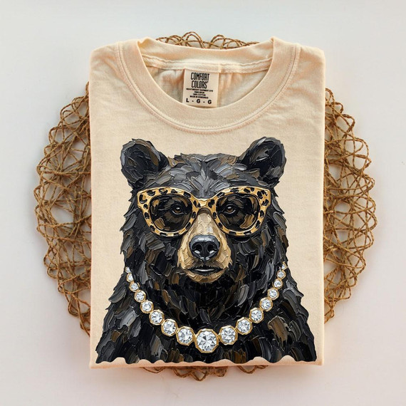 Glam Bear DTF Transfer, detailed image of a T-shirt featuring an artistic bear with sunglasses and a diamond necklace.