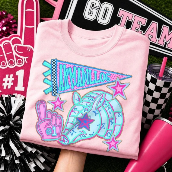 Blue Mascot DTF Transfers | School Spirit Mascot Collection, vibrant and colorful design of a unicorn with stars and the text 'ARMADILLOS' on a pink shirt, perfect for school spirit apparel.