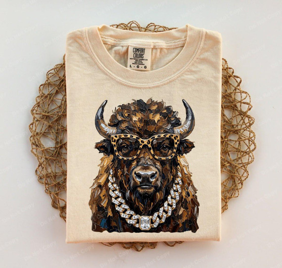 Glam Buffalo DTF Heat Transfer, detailed image of a t-shirt with a stylish buffalo graphic wearing sunglasses and jewelry.