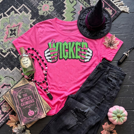 Wicked Halloween Sequin Patch, colorful sequin patch with the word 'MICKIES' and skull hands design on a pink T-shirt for Halloween costume or decoration.