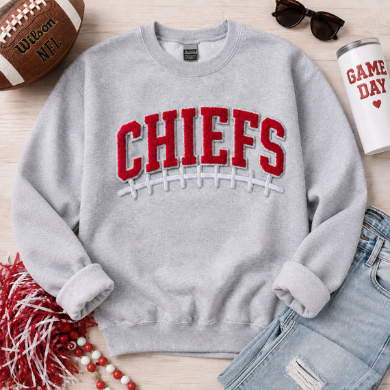 Chiefs football apparel patch with red chenille varsity letters, sequin outline, embroidered white football laces and silver glitter backing