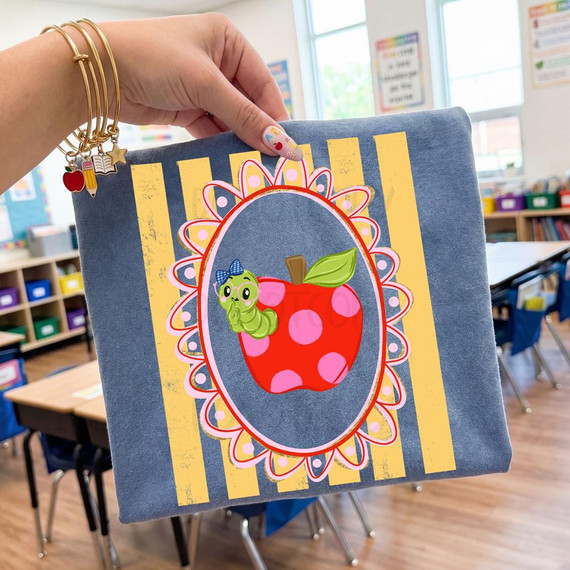 Bookworm Apple Teacher DTF Transfer, back to school DTF decorative fabric design with apple and worm on denim background.