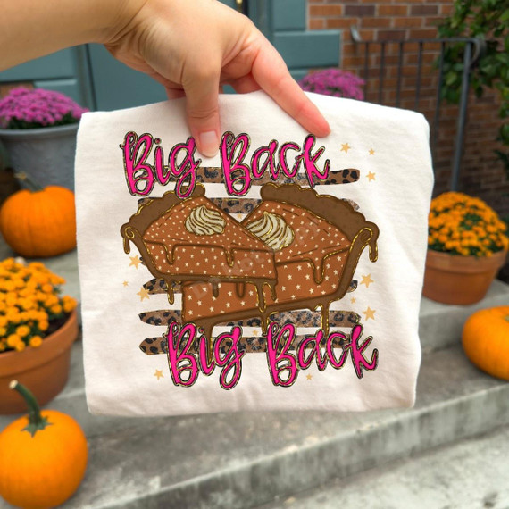 Big Back Pumpkin Pie DTF Transfer, humorous Thanksgiving-themed design featuring two pumpkin pies with whipped cream and dripping caramel, and the phrase 'Big Back' repeated twice in vibrant pink and black outlining.