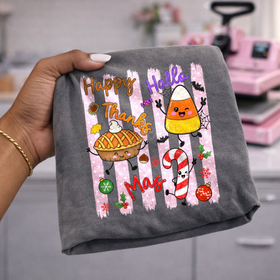 Happy Hallothanksmas DTF transfer with kawaii candy corn, pumpkin pie, and candy cane characters on a pink striped background