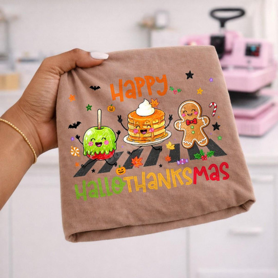 Happy Hallothanksmas DTF Transfer, Halloween, Thanksgiving, and Christmas crossover design featuring animated desserts and holiday symbols on a fabric.