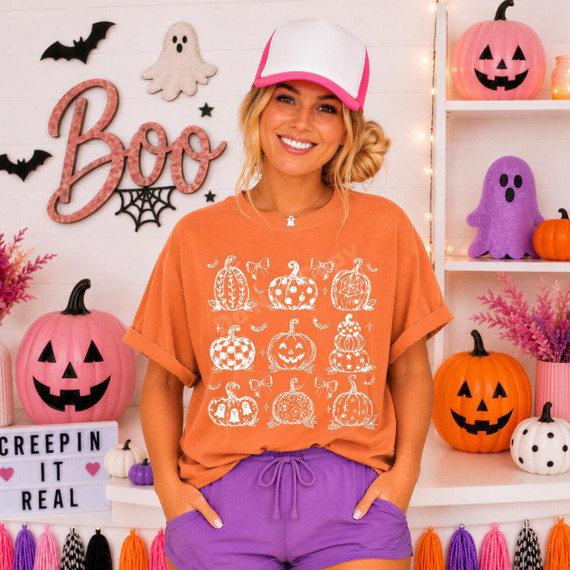 White line-art pumpkin grid DTF transfer with nine hand-drawn pumpkin styles including checkered, floral, spiderweb, ghost, and jack-o'-lantern designs