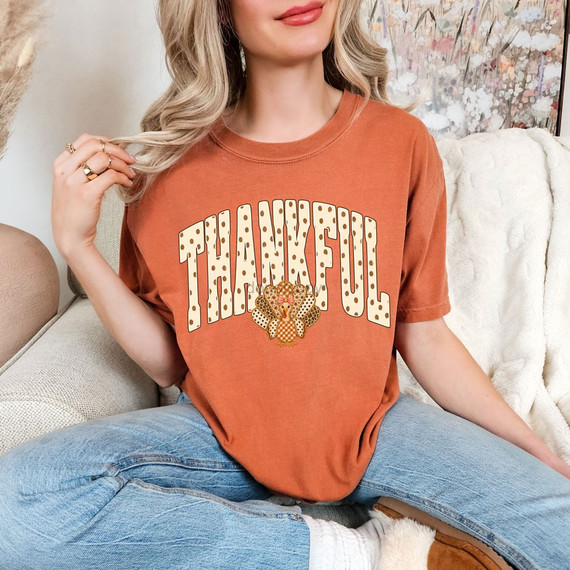 Thankful DTF transfer with polka dot arched lettering and a plaid patterned turkey graphic for Thanksgiving shirts