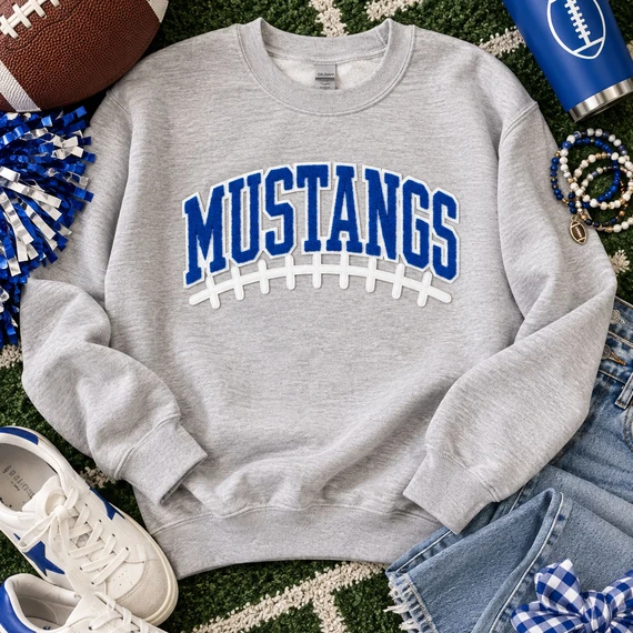 Royal blue and white Mustangs football chenille patch with varsity lettering, puff embroidered football laces and thin sequin outline for game day apparel