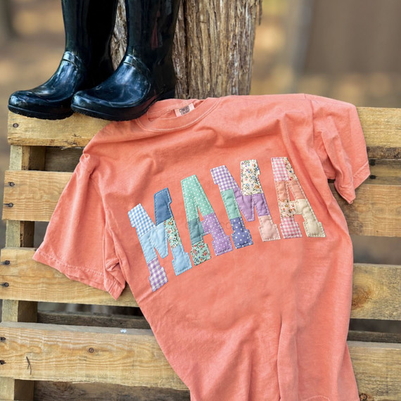 Faux quilt-style MAMA DTF transfer with patchwork floral, gingham, and check lettering and stitched-edge detailing on a coral shirt