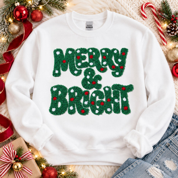 Green Merry & Bright fluffy Christmas patch with red and white polka dot accents on white sweatshirt