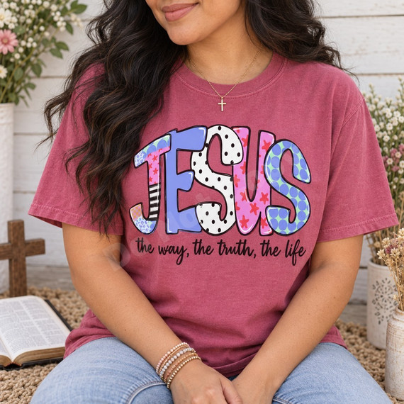 JESUS bubble-letter DTF transfer in mixed boutique patterns with black stars, above hand-lettered 'the way, the truth, the life' phrase Shown on a Berry t-shirt.