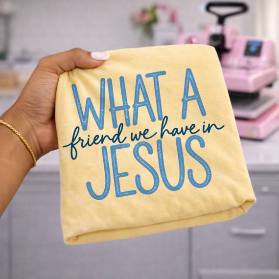 What A Friend We Have In Jesus DTF transfer in blue retro lettering on a yellow shirt