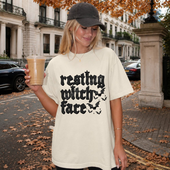 Resting Witch Face Halloween DTF transfer with distressed black lettering, stars, and bats design on a cream t-shirt