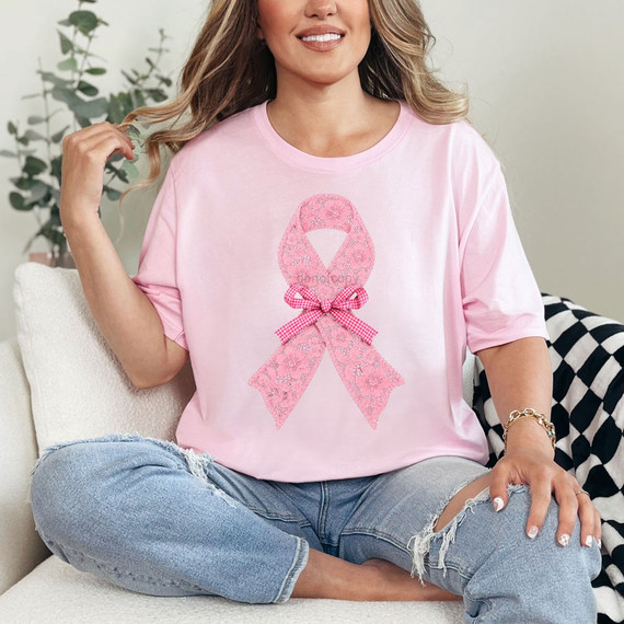 Pink breast cancer awareness ribbon DTF transfer with floral lace texture and gingham bow accent