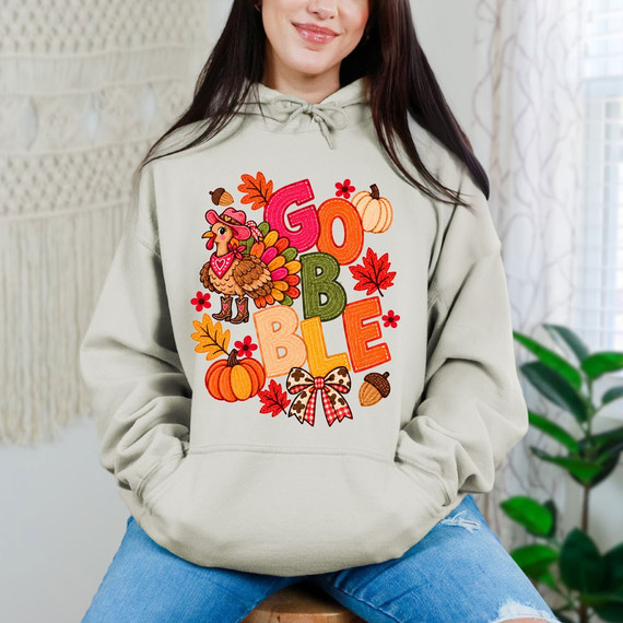 Gobble DTF transfer with western turkey wearing boots and bandana, fall leaves, pumpkins, and a cheetah gingham bow