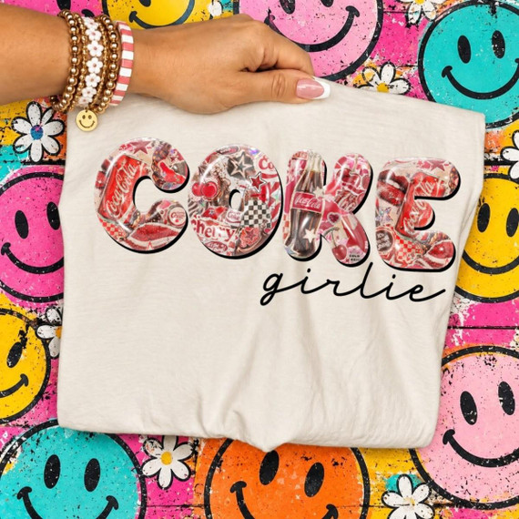 Drink Girlie DTF Transfers | Multiple Options, colorful retro soda collage design displayed on a white T-shirt against a bright smiley-face background