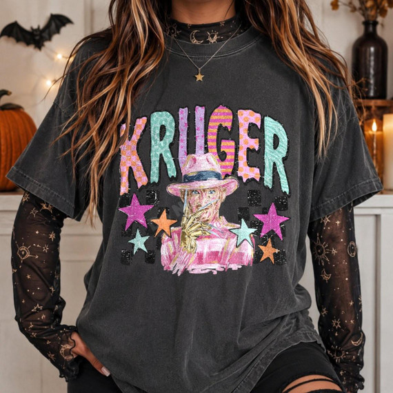 Kruger Pastel Horror DTF Transfer | Retro Halloween Slasher Design, pastel retro slasher graphic featuring a horror character, colorful stars, and bold lettering displayed on a charcoal T-shirt