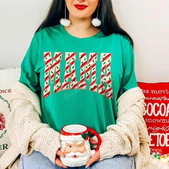 Christmas Cookie Mama DTF Transfer | Candy Cane Cookie Lettering Design, red-and-white candy cane cookie lettering with green sprinkles displayed on a teal shirt