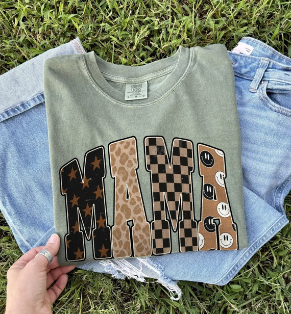 MAMA DTF transfer in mixed print letters with stars, leopard, checkered, and smiley face patterns in neutral brown and black tones