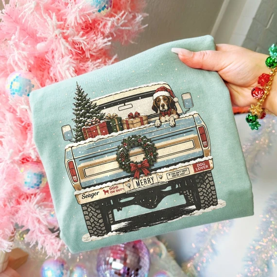 Christmas DTF transfer of a vintage truck tailgate with a beagle in a Santa hat, wrapped gifts, Christmas tree, and a wreath with a MERRY license plate