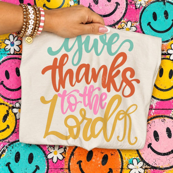 Give Thanks to the Lord DTF transfer in colorful hand-lettered script with teal, orange, pink, and mustard lettering