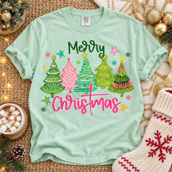 Merry Christmas Whimsical Trees DTF Transfer | Pastel Holiday Design, pastel Christmas tree graphic with colorful stars and “Merry Christmas” lettering displayed on a mint green T-shirt