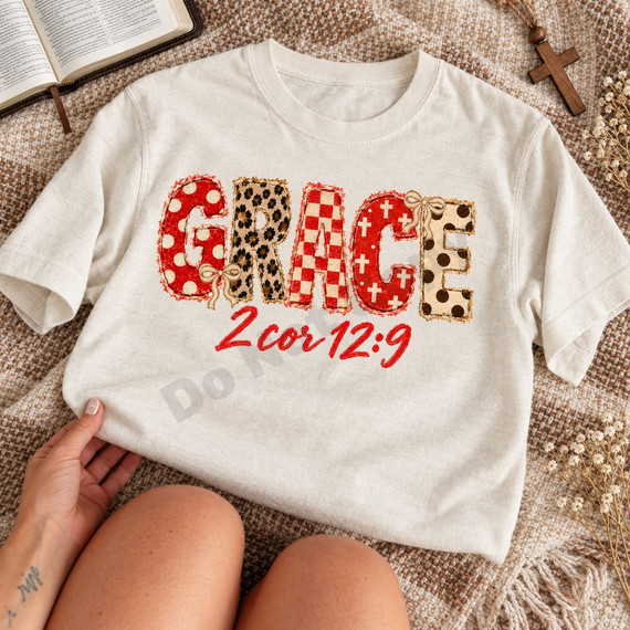 GRACE DTF transfer in mixed red, cream, and leopard print applique-style letters with bows and a red script 2 Cor 12:9 Bible verse underneath Shown on a Ivory t-shirt.