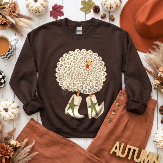 Leopard print turkey DTF transfer wearing western star boots, Thanksgiving fall design on a sweatshirt