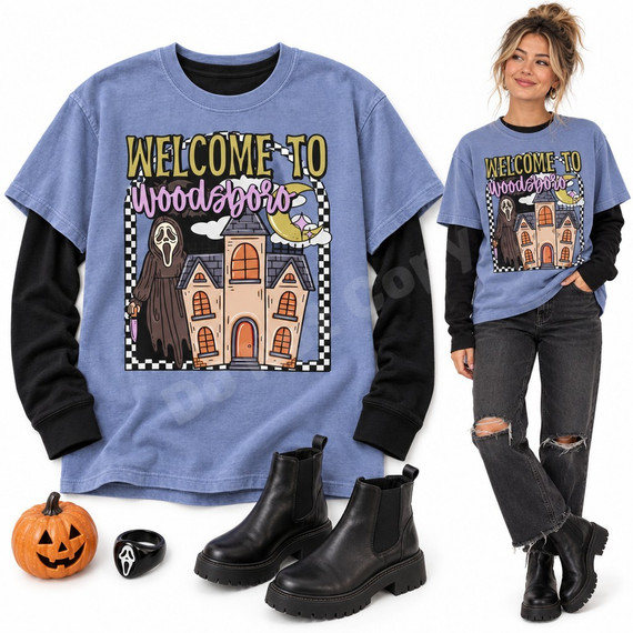 Welcome to Woodsboro Halloween DTF transfer with a dark-robed masked killer holding a dagger beside a haunted Victorian house, crescent moon, and checkered border Shown on a Periwinkle t-shirt.