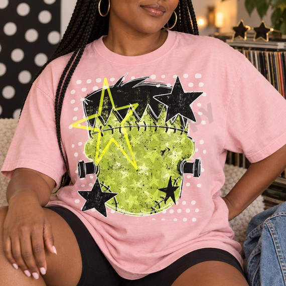 Grunge-style Frankenstein head design DTF transfer with black and white sketchy stars, neon yellow lightning bolt, and distressed chartreuse texture framed by polka dot accents Shown on a Blossom t-shirt.