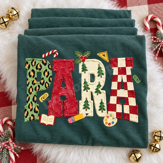 PARA chunky bubble letter DTF transfer with leopard print, red paint texture, Christmas tree, and checkerboard patterns surrounded by holly, a candy cane, a pencil, and a paint palette Shown on a Blue Spruce t-shirt.