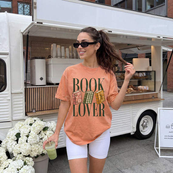 Book Lover DTF transfer with green polka dot lettering and illustrated stacked books design