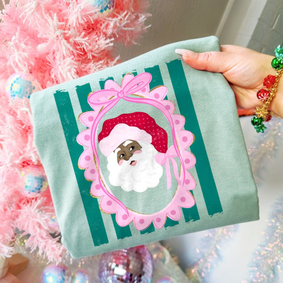 Santa face DTF transfer in a pink scalloped polka dot frame with bow over green stripes, preppy Christmas design