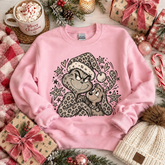 Grumpy green Christmas character and his dog in leopard print Santa hat DTF transfer with stars and hearts, hand-drawn holiday style