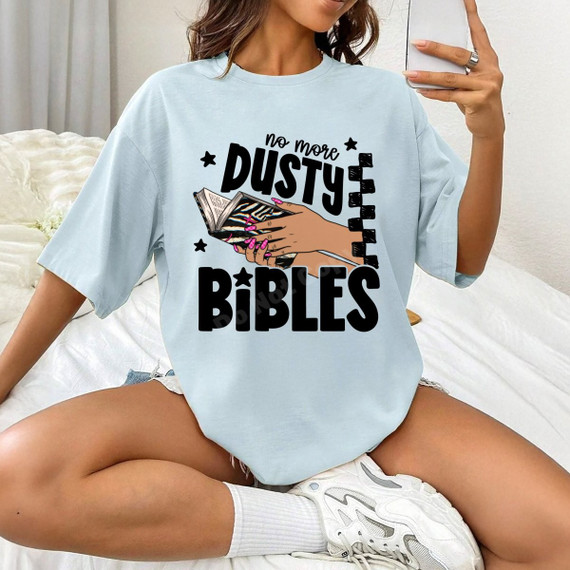 No More Dusty Bibles DTF transfer with bold black lettering, stars, and illustration of hands holding an open zebra-print Bible
