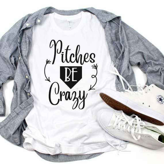 Pitches Be Crazy Baseball Sublimation Transfer, white T-shirt with black and white design and lettering, casual outfit with gray shirt and white sneakers.
