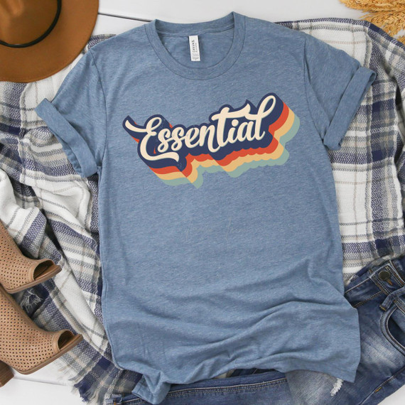 Essential FINAL STOCK Screen Print Heat Transfer T-shirt with colorful, retro-style graphic design on blue fabric.