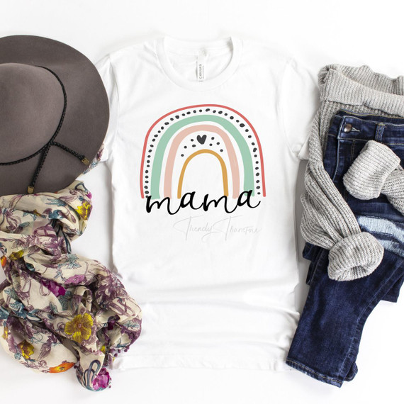 Mama pastel rainbow Sublimation Transfer, colorful rainbow design on a white T-shirt with 'mama' text, surrounded by accessories including a hat, scarf, and jeans.