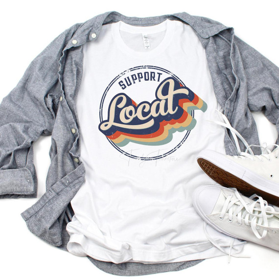 Support Local distressed retro vintage sublimation transfer on a white t-shirt, with a gray jacket and white sneakers surrounding it.
